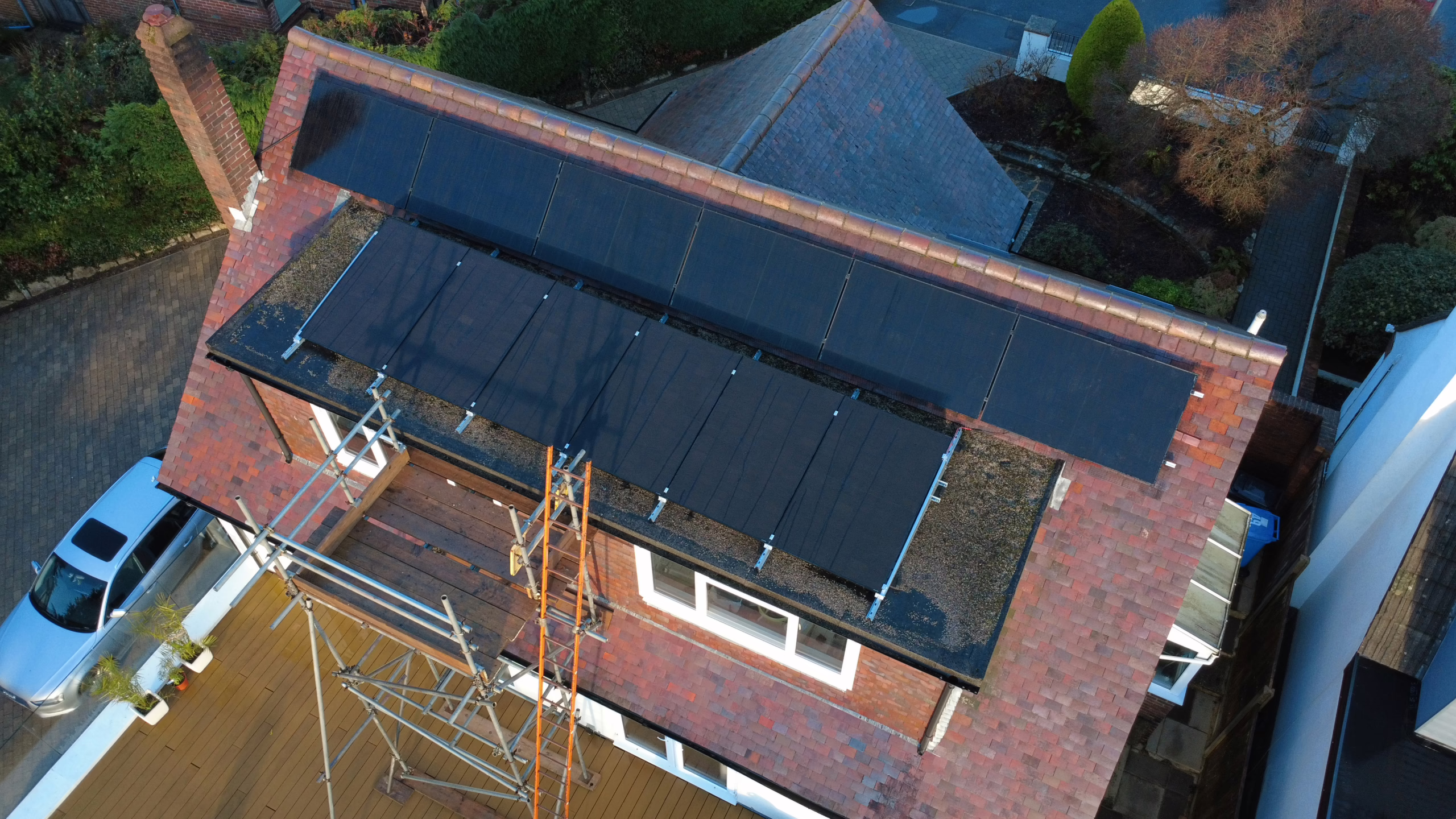 Aerial view of Starks Solar panel installation in Broadstone, Poole showing flat and pitched roof mounting